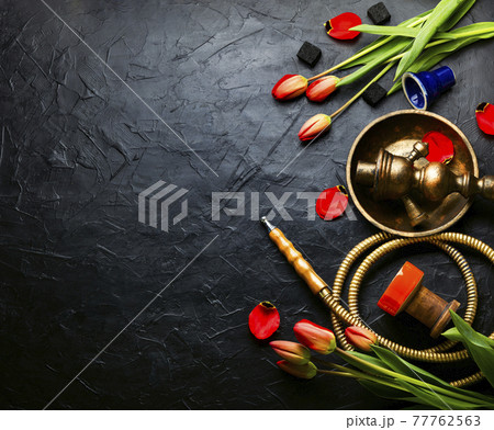 Smoking hookah with floral aroma,copy space 77762563