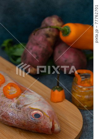 Still life with fresh fish and ingredients for cooking 77762701