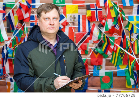 The head of an international company writes information in a notebook The head of an international company writes information in a notebook 77766729
