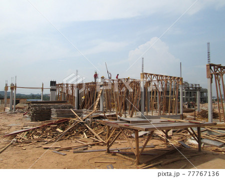 KUALA LUMPUR, MALAYSIA -SEPTEMBER 19, 2016: Column timber form work and reinforcement bar at the construction site. The structure supported by temporary wood support 77767136