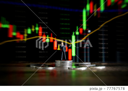 Business concept. Businessman standing on a pile of silver coins. Business concept. Businessman standing on a pile of silver coins. 77767578