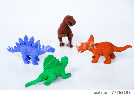 Triceratops, Stegosaurus, Spinosaurus and Tyrannosaurus dinosaur model made from multicolor rubber isolated on white background.   77768198