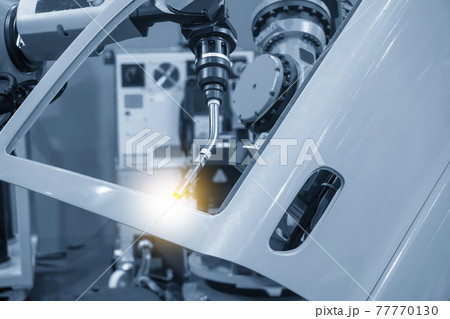 The welding robot working with automotive parts . 77770130