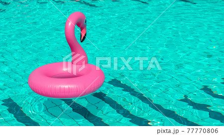 Summer fun. Pink inflatable flamingo in pool water for summer beach background. Luxury lifestyle travel. Summer fun. Pink inflatable flamingo in pool water for summer beach background. Luxury lifestyle travel. 77770806