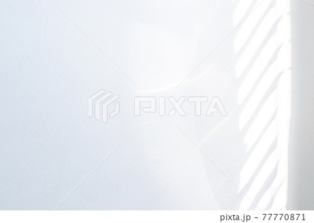 Architectural shadows. Sunlight architecture abstract background with light, black shadow overlay from window on white texture wall. Mockups, posters, stationary, wall art, design presentation. 77770871
