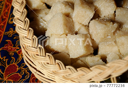 Glutinous rice or locally called pulut impit cook and steam and the press in a container. It was then cut into cubes before serving. Malay traditional food. 77772236