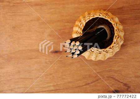 Pencils tied with a rope of straw and place in a container that is made from woven rattan. Pencils tied with a rope of straw and place in a container that is made from woven rattan. 77772422