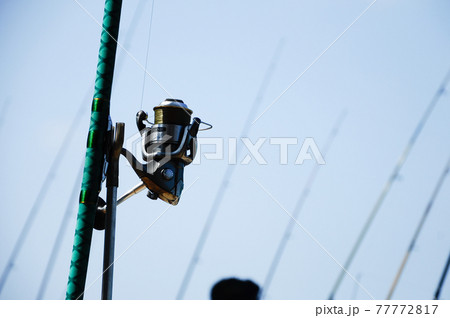 PORT DICKSON, MALAYSIA -APRIL 28, 2017: Fishing rods complete with the motor used by fisherman. These rods are used to fish in coastal fishing. PORT DICKSON, MALAYSIA -APRIL 28, 2017: Fishing rods complete with the motor used by fisherman. These rods are used to fish in coastal fishing. 77772817