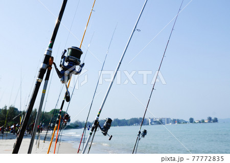 PORT DICKSON, MALAYSIA -APRIL 28, 2017: Fishing rods complete with the motor used by fisherman. These rods are used to fish in coastal fishing. PORT DICKSON, MALAYSIA -APRIL 28, 2017: Fishing rods complete with the motor used by fisherman. These rods are used to fish in coastal fishing. 77772835