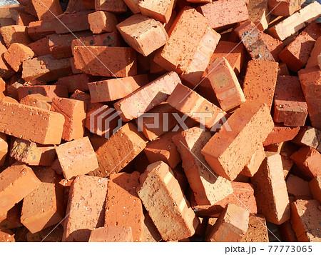 Clay bricks are piled on the construction site Clay bricks are piled on the construction site 77773065