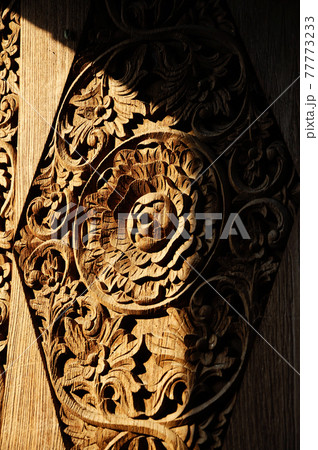 JOGJAKARTA, INDONESIA -JUNE 12, 2014: Wood carving detail with floral & arabic word at old Mosque of Masjid Besar Mataram Kotagede. Build on 1575.   77773233