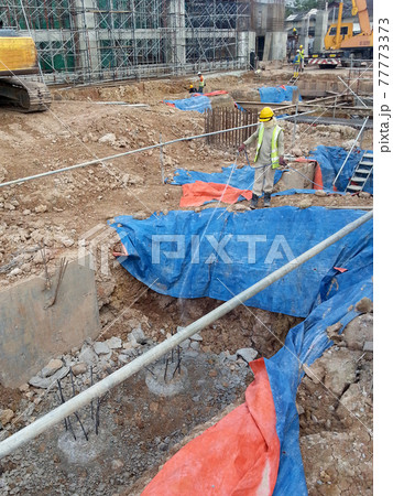 JOHOR, MALAYSIA -MARCH 29, 2016: Construction workers spraying the anti termite chemical treatment to the soil at the construction site.  77773373