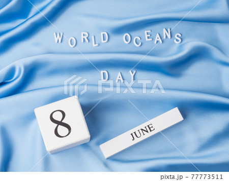 World oceans day in white letters on blue wave textile, june 8 holiday 77773511