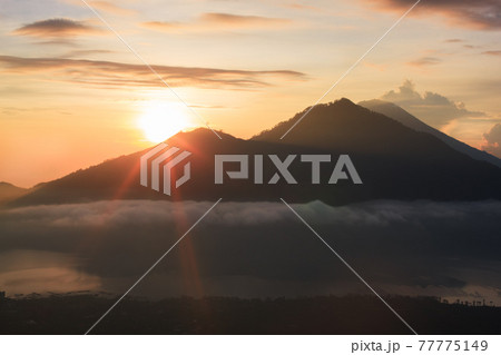 Active volcano. Sunrise from the top of Mount Batur - Bali, Indonesia 77775149