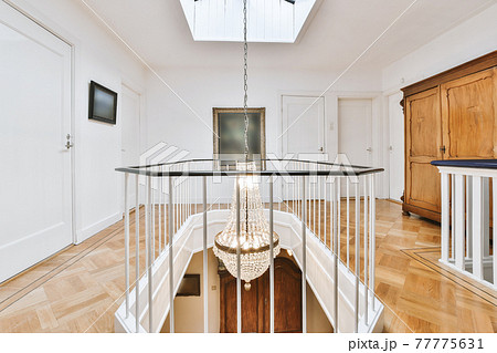 Crystal chandelier on upper floor of house 77775631
