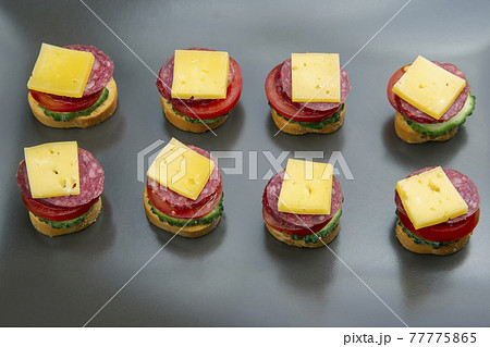 light sandwiches made of vegetables, cheese and sausages. fast food and breakfast light sandwiches made of vegetables, cheese and sausages. fast food and breakfast 77775865