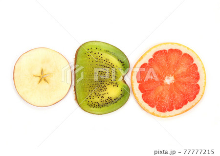 across sliced kiwi, apple and grapefruit on white background 77777215