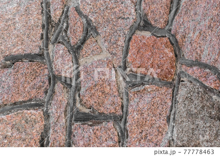 Cobblestones handmade stone old wall texture background Cobblestones handmade stone old wall texture background 77778463