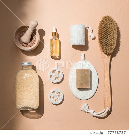 Body treatment and spa composition. Flat lay with natural beauty products. Eco cream, serum, skin care blank bottle. Brush for dry anti-cellulite massage. Dropper glass Oily cosmetic pipette Body treatment and spa composition. Flat lay with natural beauty products. Eco cream, serum, skin care blank bottle. Brush for dry anti-cellulite massage. Dropper glass Oily cosmetic pipette 77778727