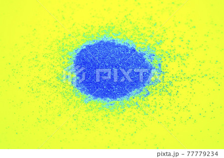 bright blue sand on a bright yellow background. Very bright colo bright blue sand on a bright yellow background. Very bright colo 77779234