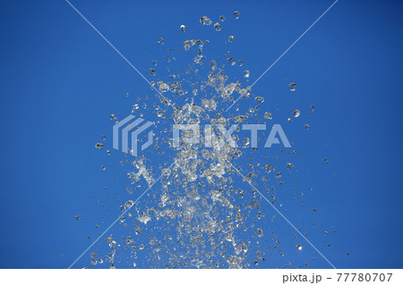 drops water of the fountain in the sky 77780707