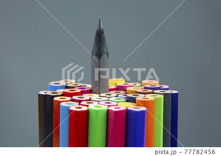 Colored pencils for drawing on a gray background. Education and creativity. Leisure and art 77782456