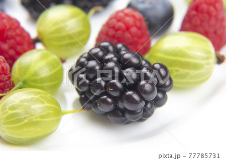 fresh different berries on a white plate. useful vitamin healthy food fruit. 77785731