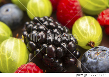 lots of fresh different berries. useful vitamin healthy food fruit. healthy vegetable breakfast 77785732