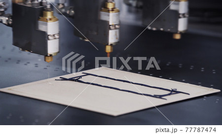 Modern automatic machine line of cardboard box. Offset printing machine - spraying glue. Conveyor line for the production Manufacture of cardboard boxes from paper. gluing of cardboard. 77787474