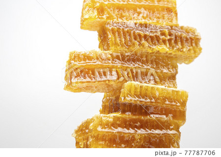 portions of fresh honeycomb on a white background. vitamin natural food. bee work product 77787706