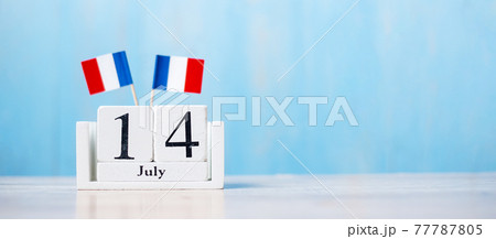 Wooden calendar of July 14th with miniature France flags. French National Day, Bastille Day and happy celebration concepts Wooden calendar of July 14th with miniature France flags. French National Day, Bastille Day and happy celebration concepts 77787805