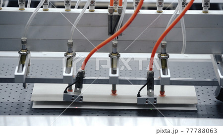 Auromatic robotic Conveyor line for production of boxes. Modern factory of production cardboard box. Manufacture of cardboard boxes from paper. Enterprise for production package 77788063