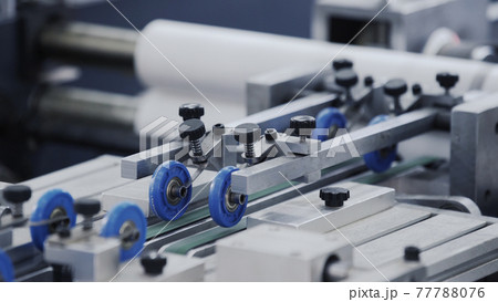 Automatic robotic Conveyor line for the production of boxes. Modern factory of production cardboard box. Manufacture of cardboard boxes from paper. Enterprise for production package 77788076