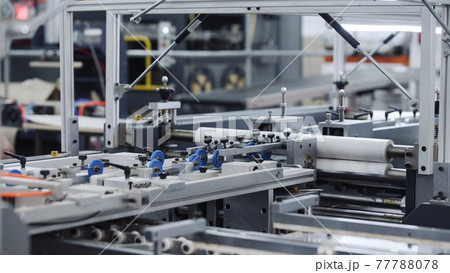 Modern automatic conveyor line for the production of package. Modern factory of production cardboard box. Manufacture of cardboard boxes from paper. Enterprise for production package 77788078