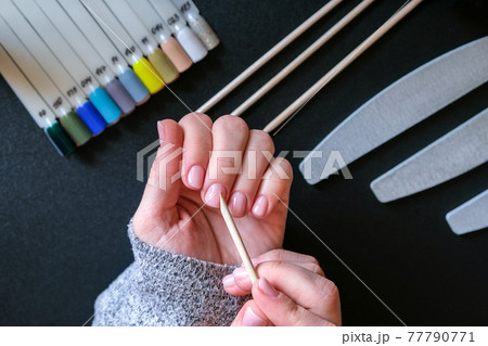 Work at home with nails. Nail care, Self care. Female manicure. Do manicure by yourself while staying at home. Female hands and manicure tools Work at home with nails. Nail care, Self care. Female manicure. Do manicure by yourself while staying at home. Female hands and manicure tools 77790771