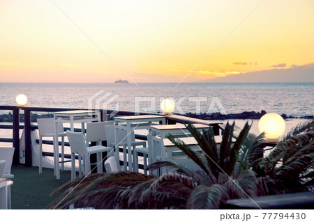 Empty bar at sunset on Tenerife island, Costa Adeje with sunset ocean view 77794430