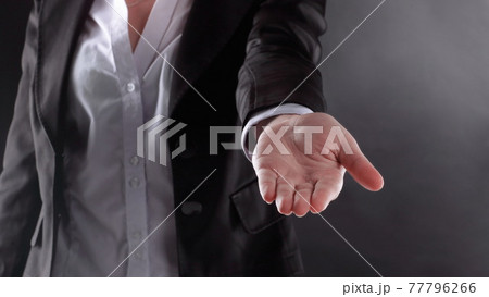 close up. business woman with open palm .isolated on black background close up. business woman with open palm .isolated on black background 77796266
