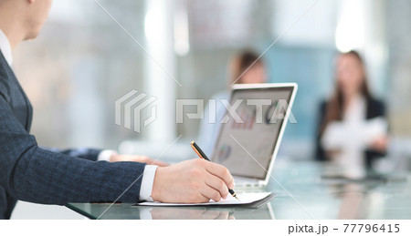 close up.businessman in the workplace in the office 77796415