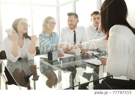 HR Manager shakes hands with the candidate for the vacant position. 77797555