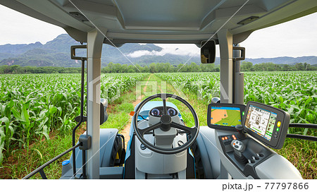 5G autonomous tractor working in corn field, Future technology with smart agriculture farming concept 5G autonomous tractor working in corn field, Future technology with smart agriculture farming concept 77797866
