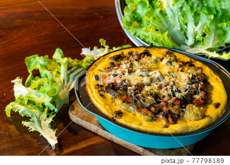 Freshly prepare homemade quiche in blue metal bowl . Freshly prepare homemade quiche in blue metal bowl . 77798189