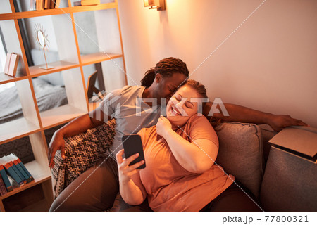 Man bonding to his caucasian woman while they making selfie together Man bonding to his caucasian woman while they making selfie together 77800321