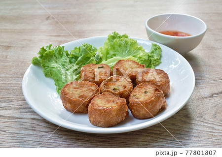deep fried mashed crab meat and pork roll Chinese food on plate dipping sweet plum sauce deep fried mashed crab meat and pork roll Chinese food on plate dipping sweet plum sauce 77801807