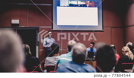 Business speaker giving talk at business conference event. Business speaker giving talk at business conference event. 77804544