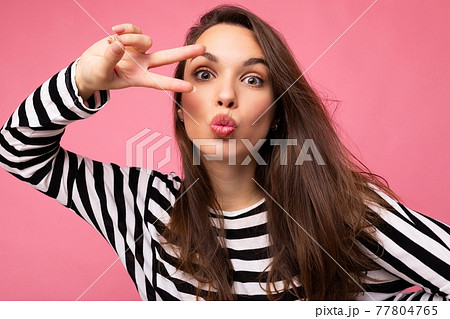 Photo of young european positive winsome sexy beautiful brunette woman with sincere emotions wearing 77804765