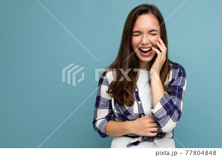 Photo portrait of young beautiful smiling hipster brunette woman in trendy blue and white shirt and Photo portrait of young beautiful smiling hipster brunette woman in trendy blue and white shirt and 77804848