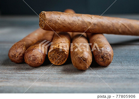 Close view of cigars on the wooden background 77805906