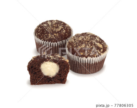 Two chocolate muffins and a half on white Two chocolate muffins and a half on white 77806305