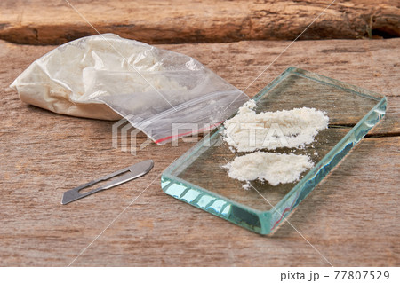 Illegal narcotic preparations, wooden background. Illegal narcotic preparations, wooden background. 77807529