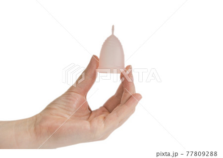 Womans hand holding menstrual cup, period cup isolated on white background with copy space, alternative product zero waste eco friendly 77809288